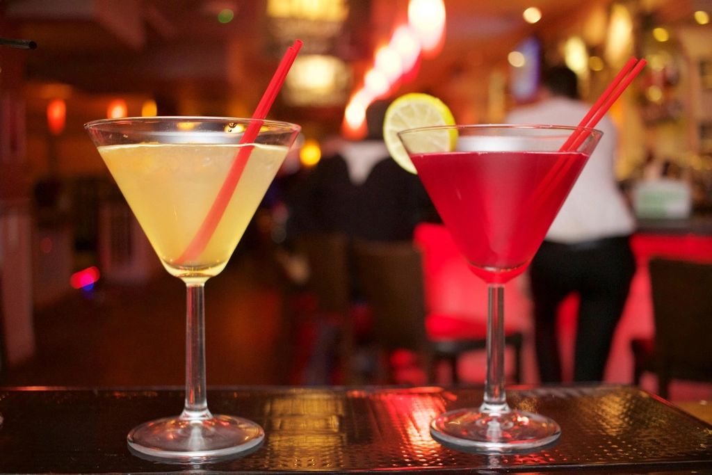 A cocktail being finished at the bar